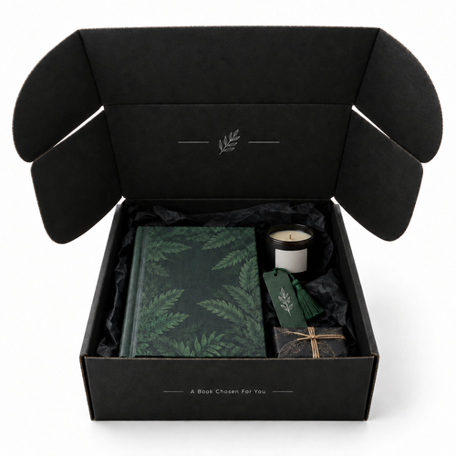 Open black Discovery Reads book subscription box with books and a candle on a white background